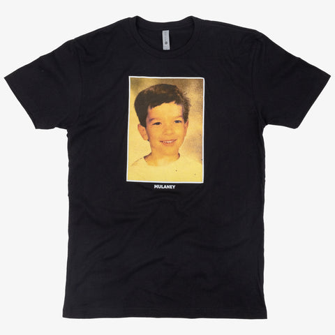 Black shirt with photo of John Mulaney as a kid with white text below "MULANEY"
