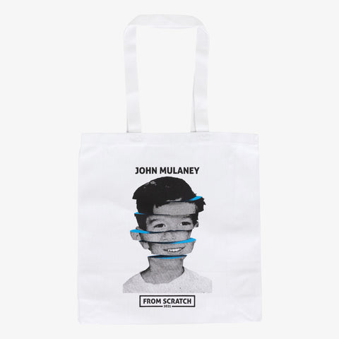 white tote bag with image of John Mulaney with text "JOHN MULANEY FROM SCRATCH 2021"